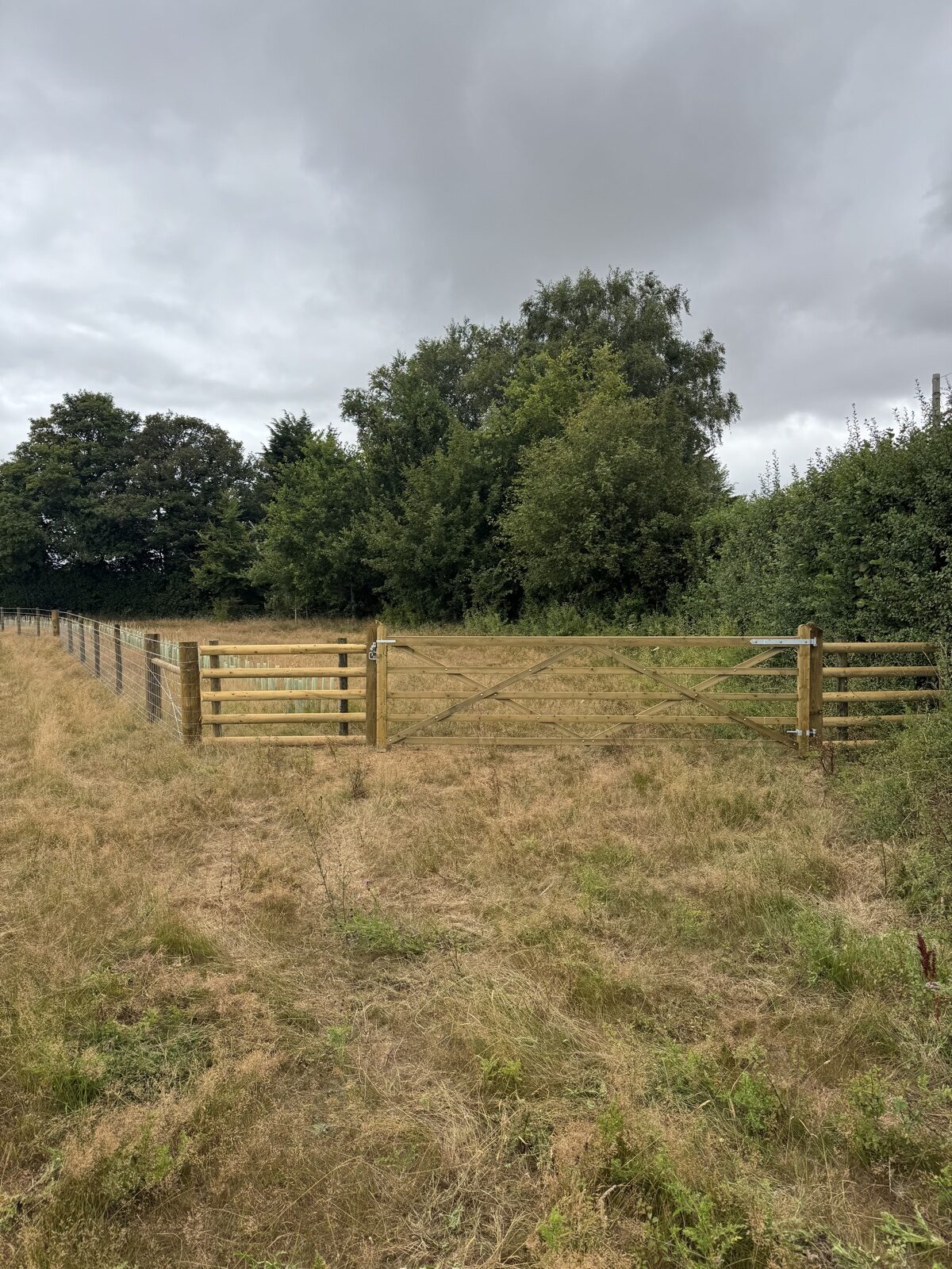 Completed field gate and agricultural fence